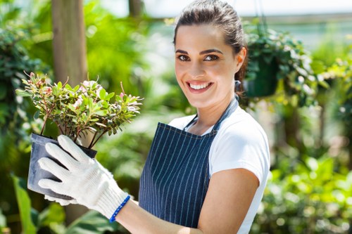 Satisfied homeowner enjoying their cleared and maintained garden